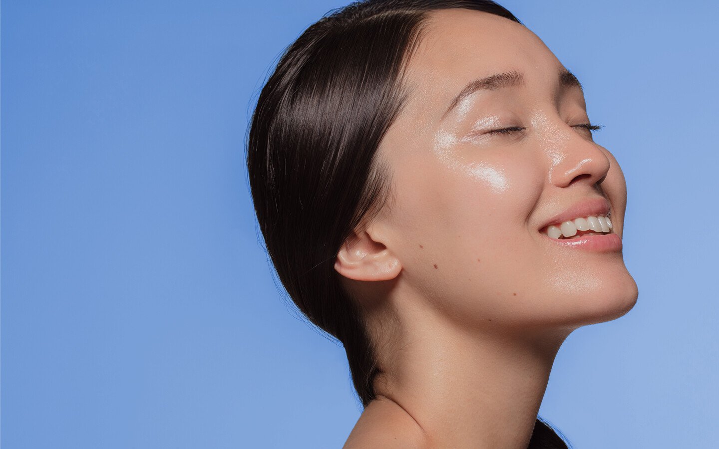 Side profile of a woman with radiant skin, representing Edge ONE laser skin resurfacing treatment.