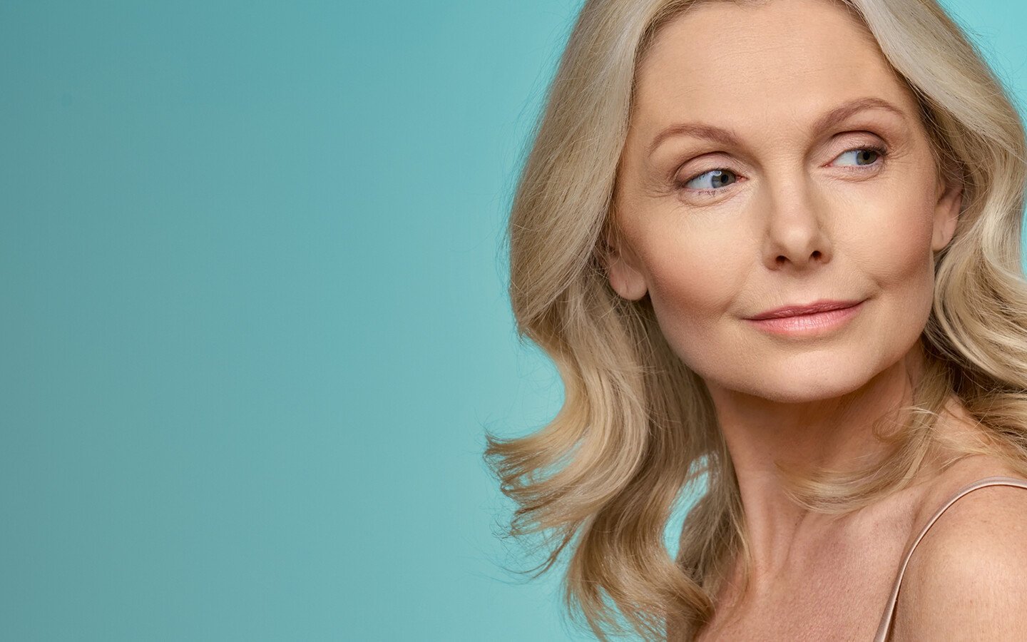 Mature woman looking to the side, representing Potenza RF microneedling treatment.
